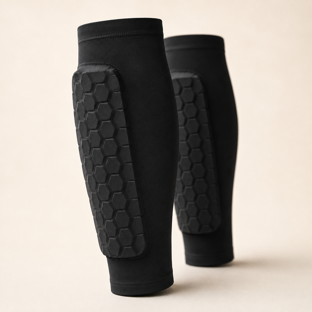 Close-up of black Alpine Guards Pro honeycomb EVA padding and stitching