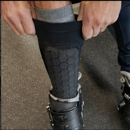 Alpine Guards positioned over ski socks before putting on ski boots